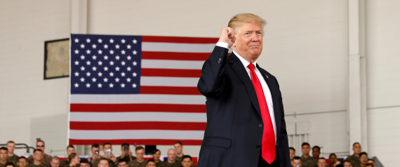 U.S. President Donald Trump pumps his fist after speaking at Marine Corps Air Station Miramar in San Diego, California