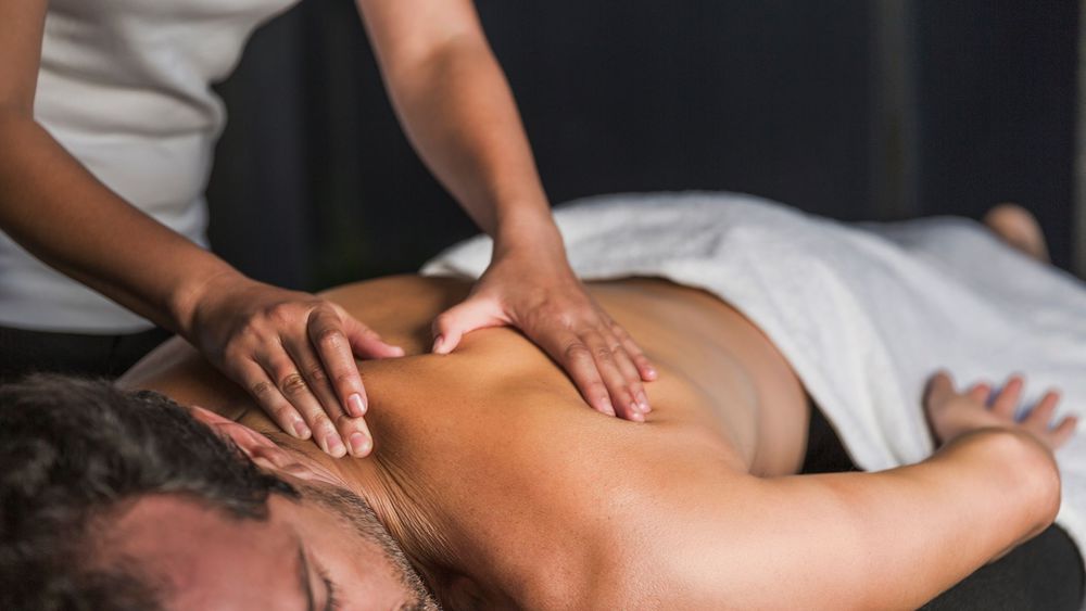 man-receives-back-massage-in-spa_5636513