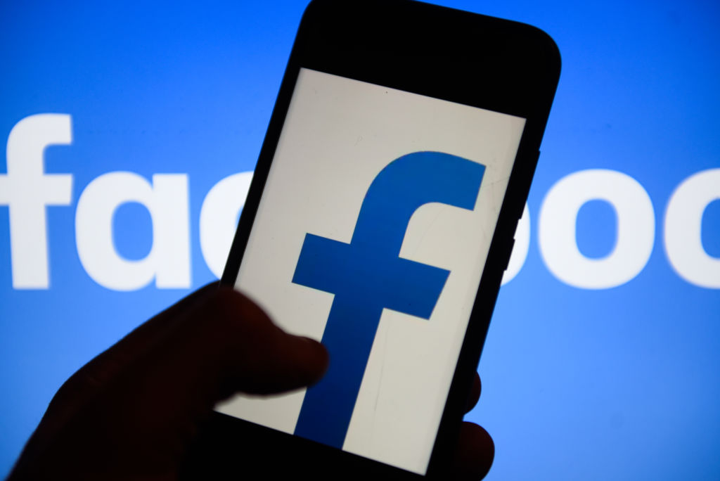 Facebook  logo is seen on an android mobile phone